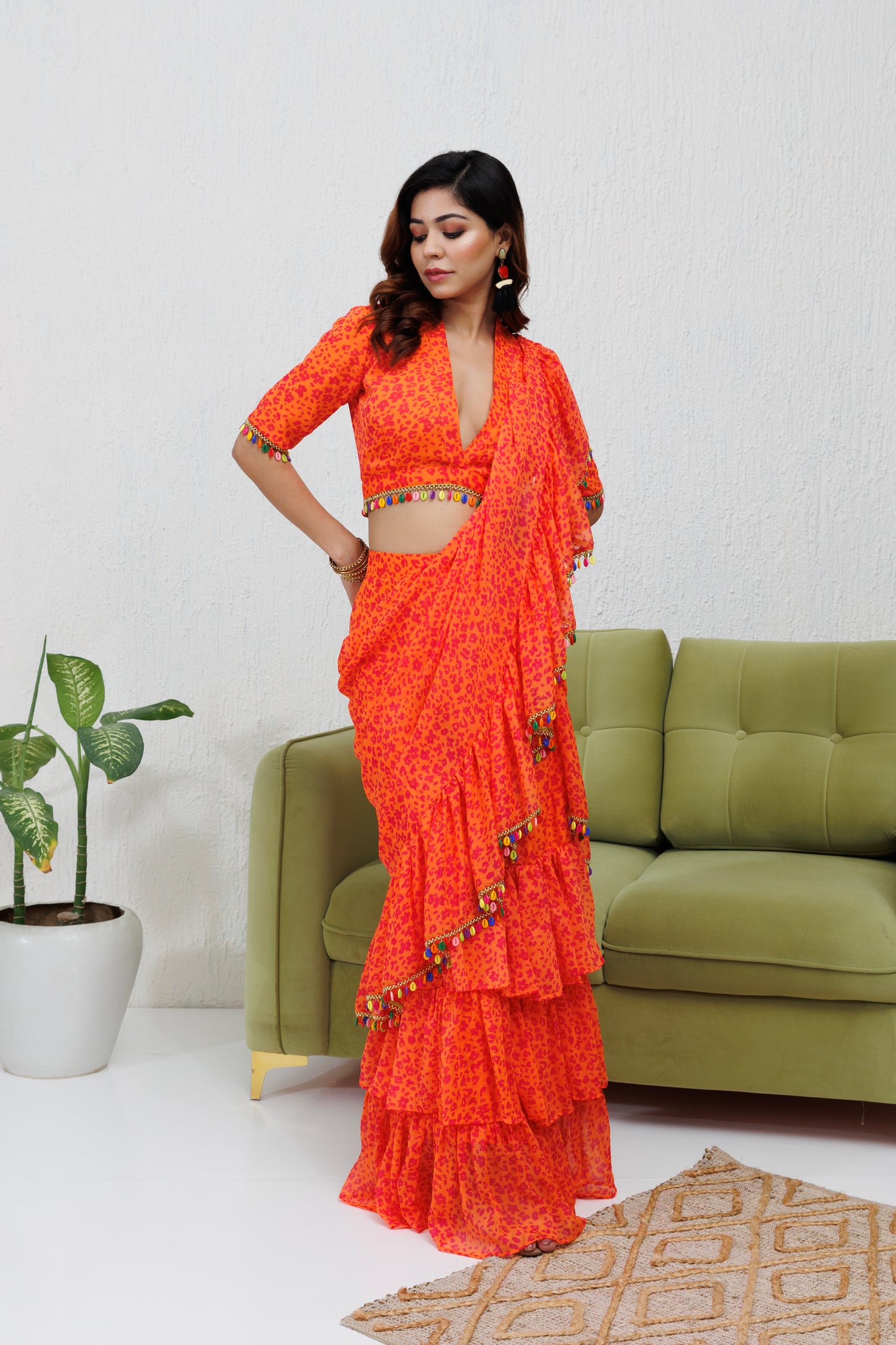 Mystique Melange: Orange printed ruffle saree