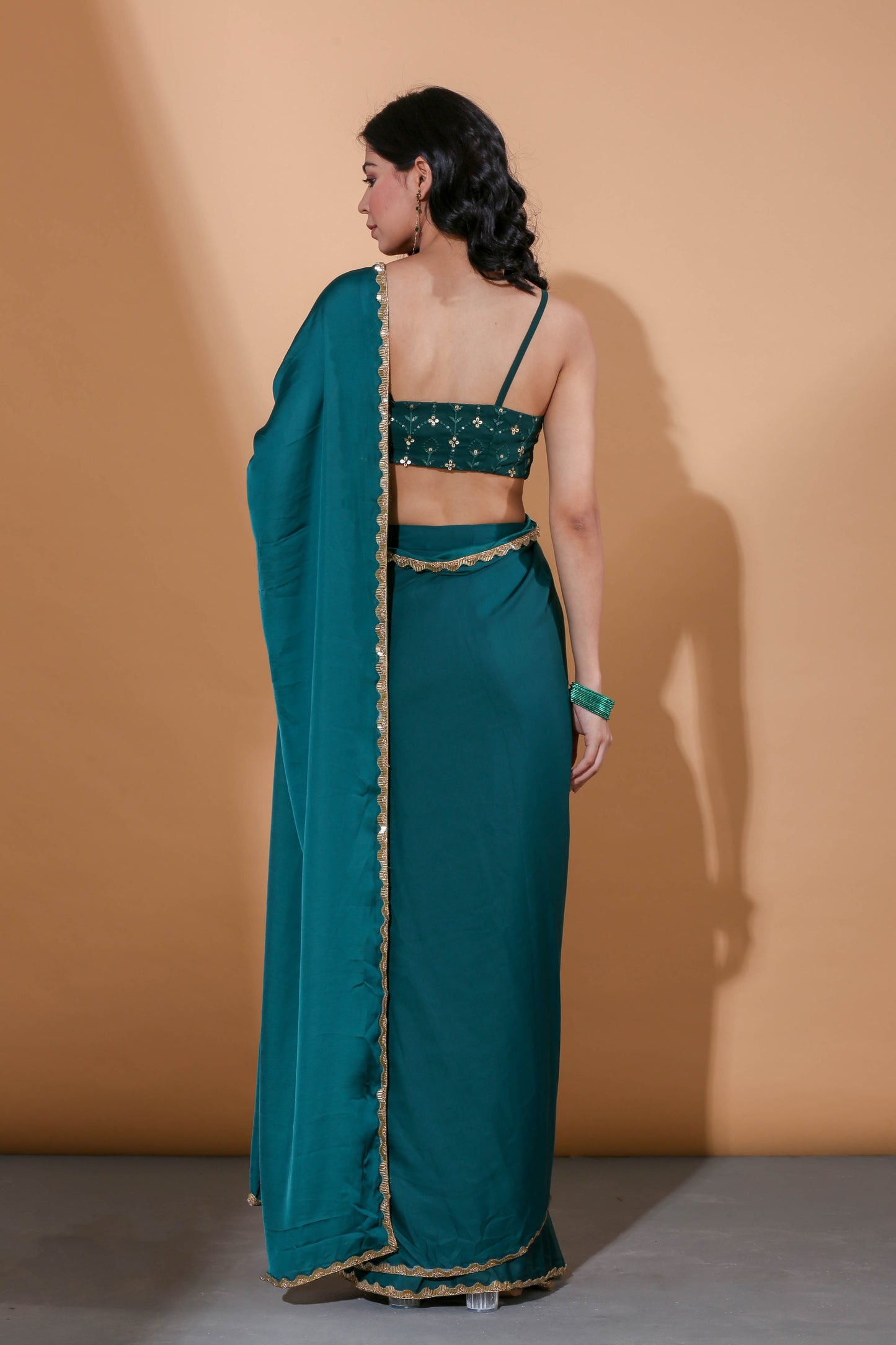 Adhikam- Dark green gold bordered saree