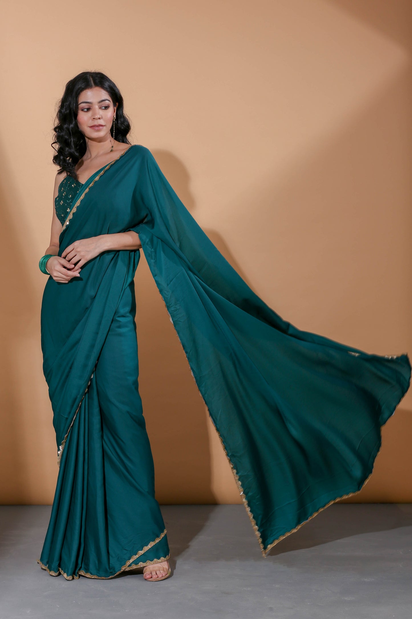Adhikam- Dark green gold bordered saree