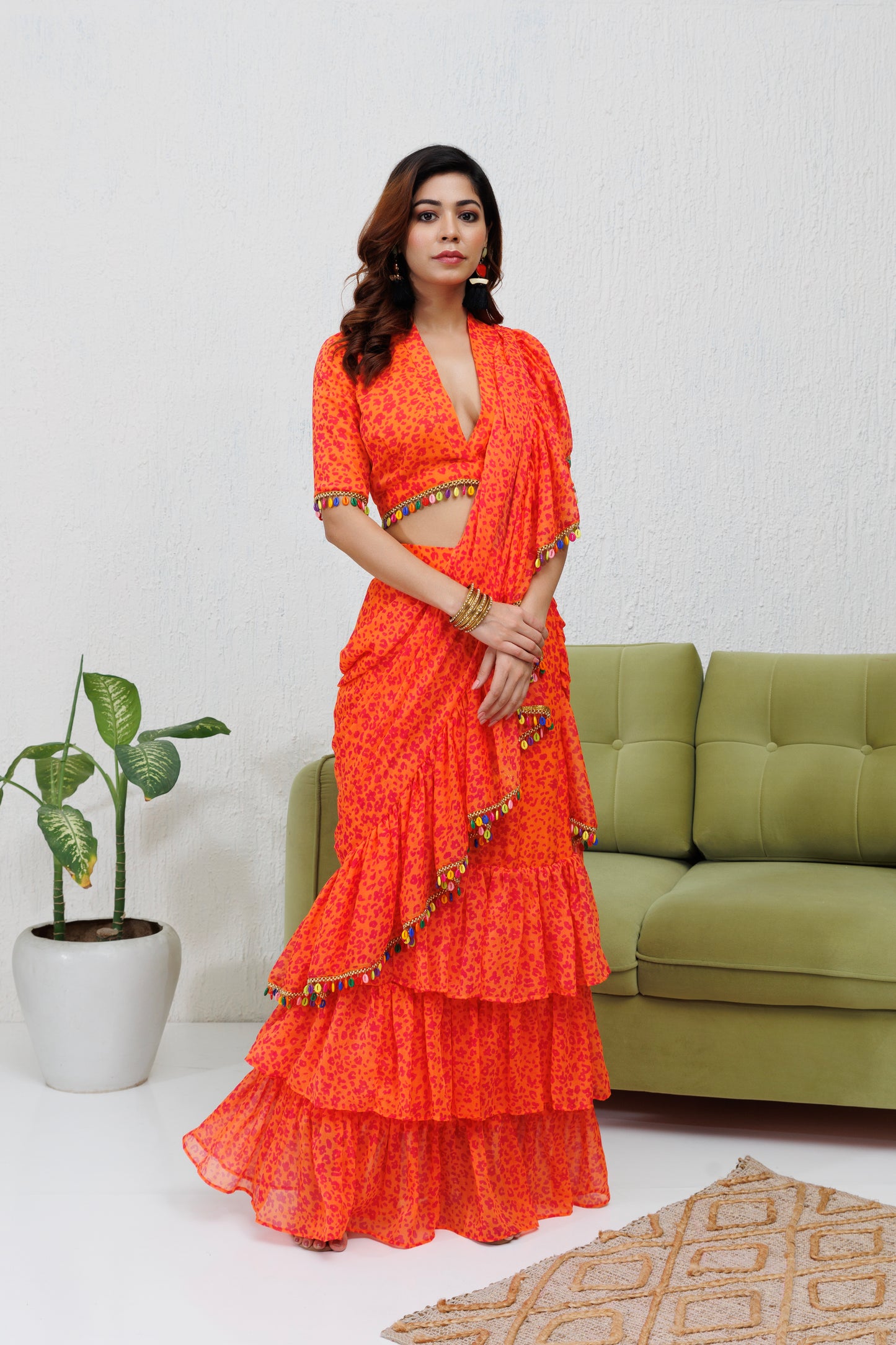 Mystique Melange: Orange printed ruffle saree