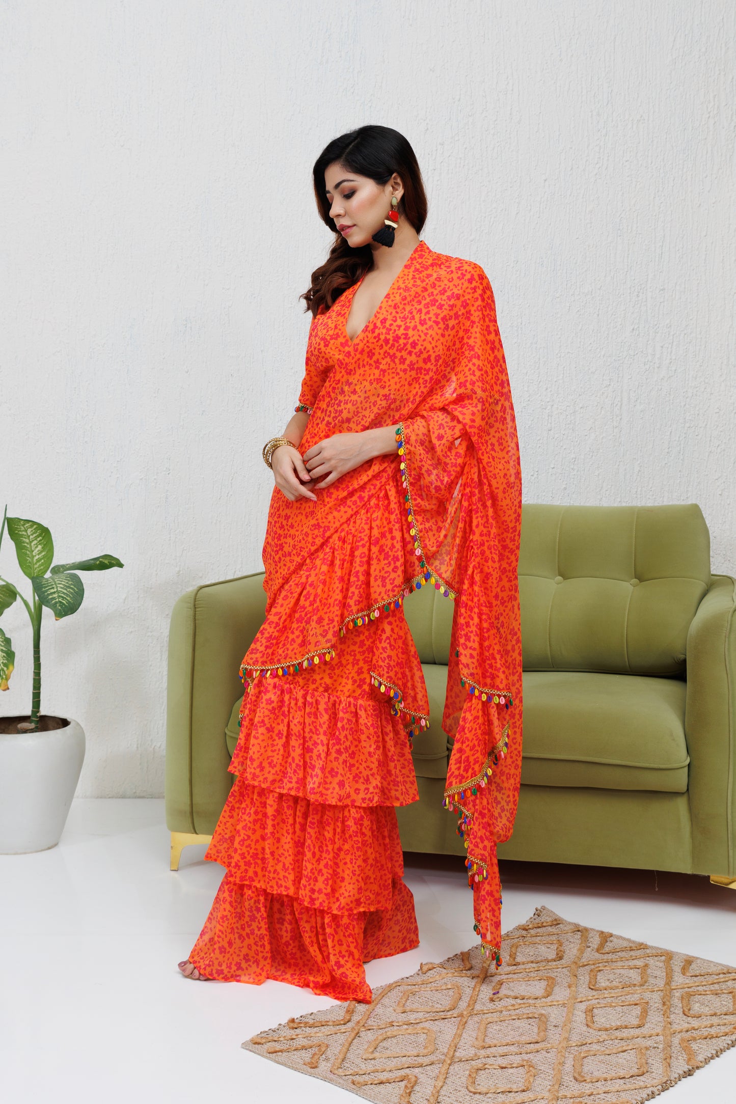 Mystique Melange: Orange printed ruffle saree