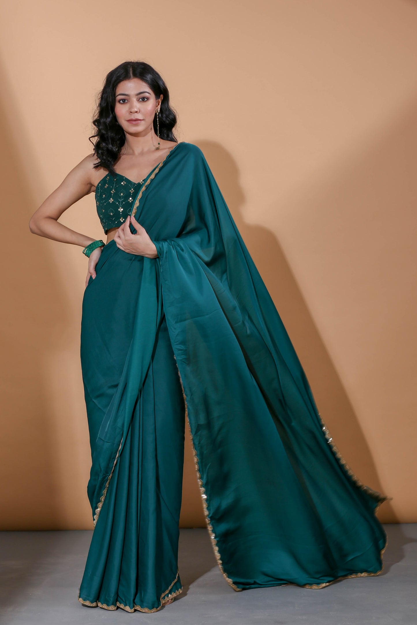 Adhikam- Dark green gold bordered saree
