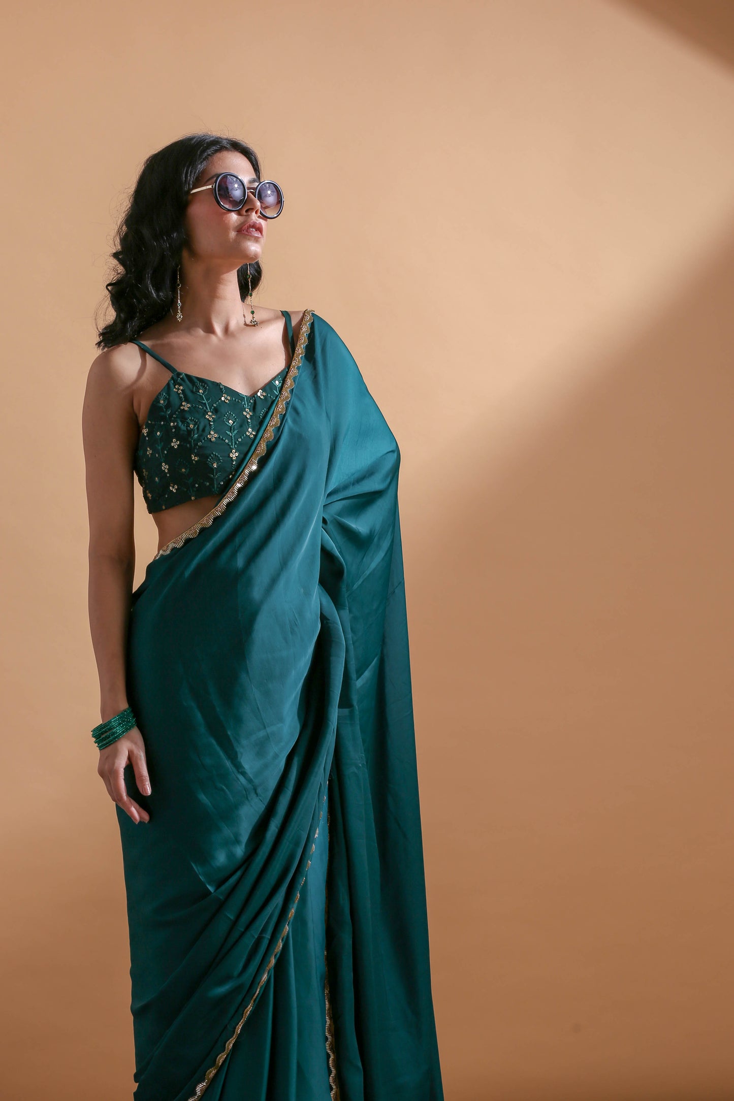Adhikam- Dark green gold bordered saree